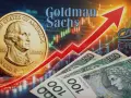 Złoty vs dolar: czy warto kupować dolary? Goldman Sachs analizuje rynek. W tle wykresy giełdowe i moneta z USA.