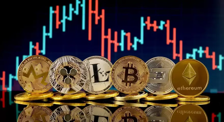 Monety kryptowalut (Bitcoin, Ethereum, Litecoin, Ripple, Dash, Monero) na tle wykresu giełdowego. Polska giełda kryptowalut w pigułce.